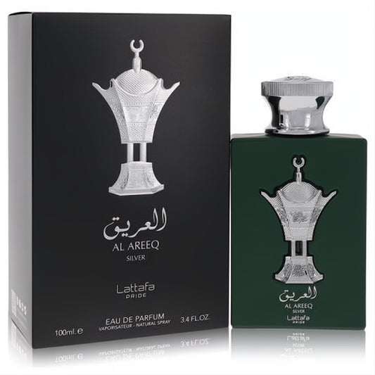 Luxurious Lattafa Pride Al Areeq Silver 3.4 oz unisex EDP. Deep green bottle, ornate silver emblem, and sophisticated black box.