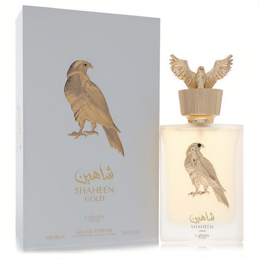 Elegant Lattafa Shaheen Gold 3.4 oz EDP, frosted bottle with gold falcon emblem and majestic winged cap.