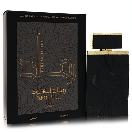 Elegant Lattafa Ramaad Al Oud 3.4 oz unisex EDP. Black textured bottle and box with striking gold lettering for a luxurious feel.