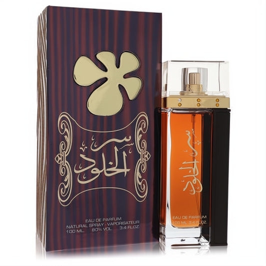 Striking Lattafa Ser Al Khulood 3.4 oz unisex EDP. Amber glass bottle with gold Arabic script, clear cap, and luxurious striped box.