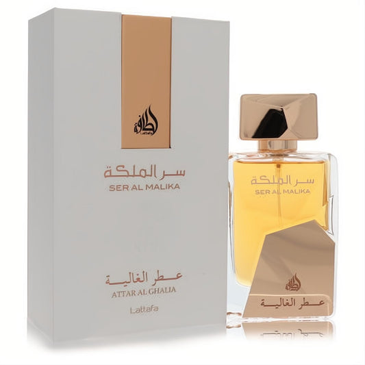 Lattafa Ser Al Malika 3.4 oz women's EDP. Elegant clear glass bottle with golden liquid, metallic gold cap, and luxurious white and gold box.