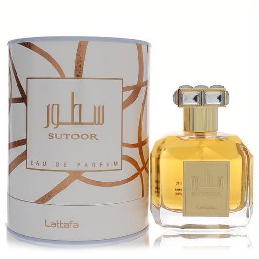 Lattafa Sutoor 3.4 oz unisex EDP. Golden liquid in a clear faceted bottle with a crystal-top gold cap, beside elegant white and gold packaging.