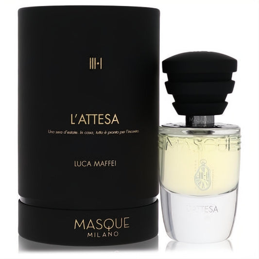 Exquisite Masque Milano L'attesa unisex EDP. Clear glass bottle with black ribbed cap and elegant matte black box with gold accents.