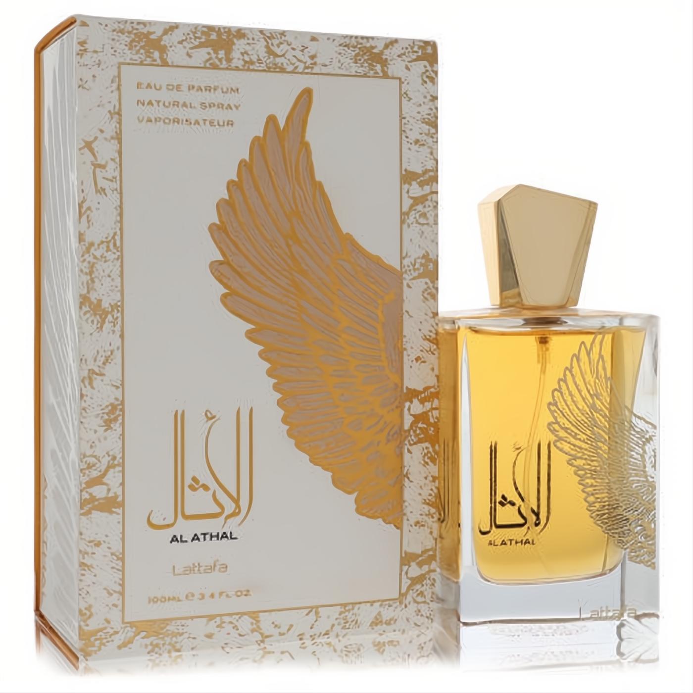 Lattfa Al Athal 3.4 oz unisex EDP. Luxurious clear bottle with golden liquid, elegant gold cap, and unique wing design on white box.