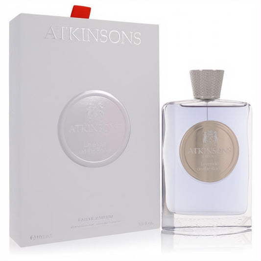 Luxurious Atkinsons Lavender on the Rocks 3.3 oz EDP. Clear bottle with light lavender liquid, gold label, silver cap, and elegant white embossed box.