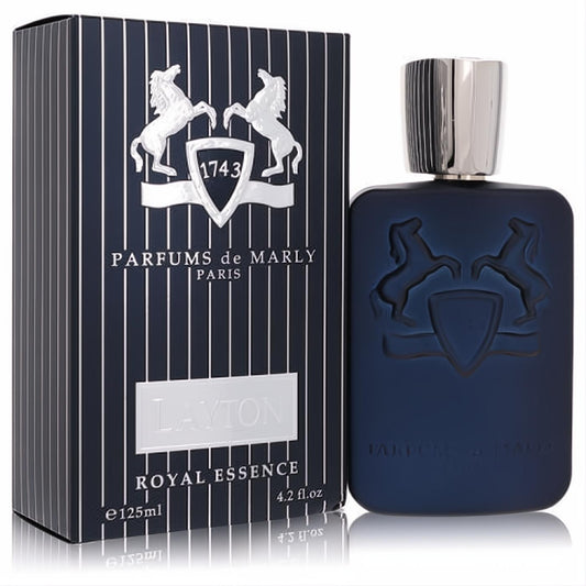 Sophisticated Layton Royal Essence 4.2 oz men's EDP. Dark blue matte bottle with embossed crest, sleek silver cap, and striped box.