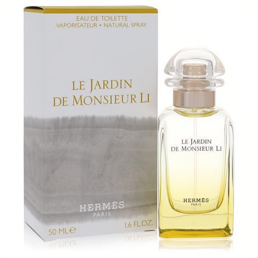 Hermes Le Jardin De Monsieur Li 1.6 oz unisex EDT. Clear bottle with radiant golden liquid, elegant white box with subtle cloud design.