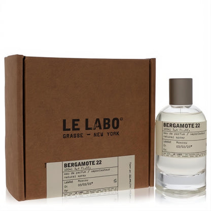 Le Labo Bergamote 22 Eau De Parfum 3.4 oz. Clear glass spray bottle with gray cap, displayed alongside its branded brown box.