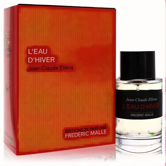 Iconic Frederic Malle L'eau D'hiver 3.4 oz EDT. Clear glass bottle with black label next to its vibrant orange-red box.