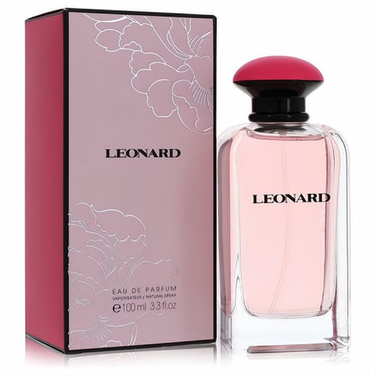 Elegant Leonard Signature 3.3 oz Eau De Parfum. Clear bottle, pink liquid, vibrant red cap, and floral pink box.
