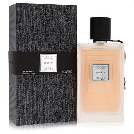Lalique Bronze 3.3 oz EDP spray. Elegant clear bottle with layered bronze liquid and luxurious textured black box.