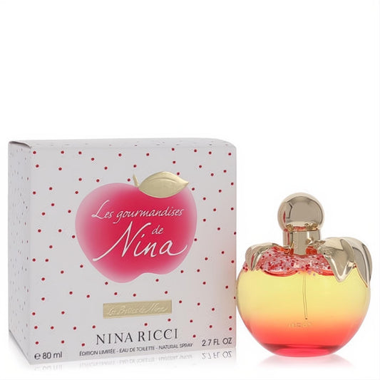 Les Gourmandises De Nina 2.7 oz limited edition perfume. Vibrant apple bottle, yellow-red ombre liquid, gold dripping cap, and polka dot box.
