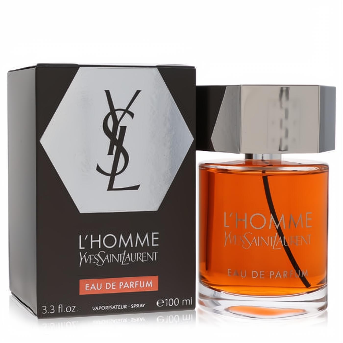 L'homme YSL Eau De Parfum 3.3 oz. Amber fragrance in a sleek clear bottle with silver cap, next to its elegant black and silver logo box.