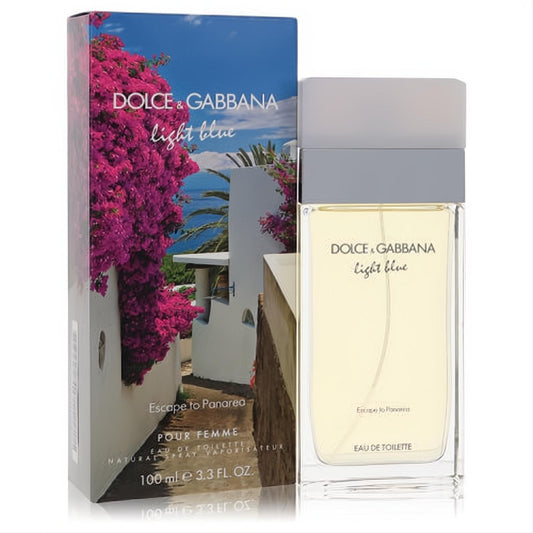 Dolce & Gabbana Light Blue Escape to Panarea 3.3 oz EDT. Clear bottle with golden fragrance, next to a vibrant box depicting a Mediterranean island with pink bougainvillea.