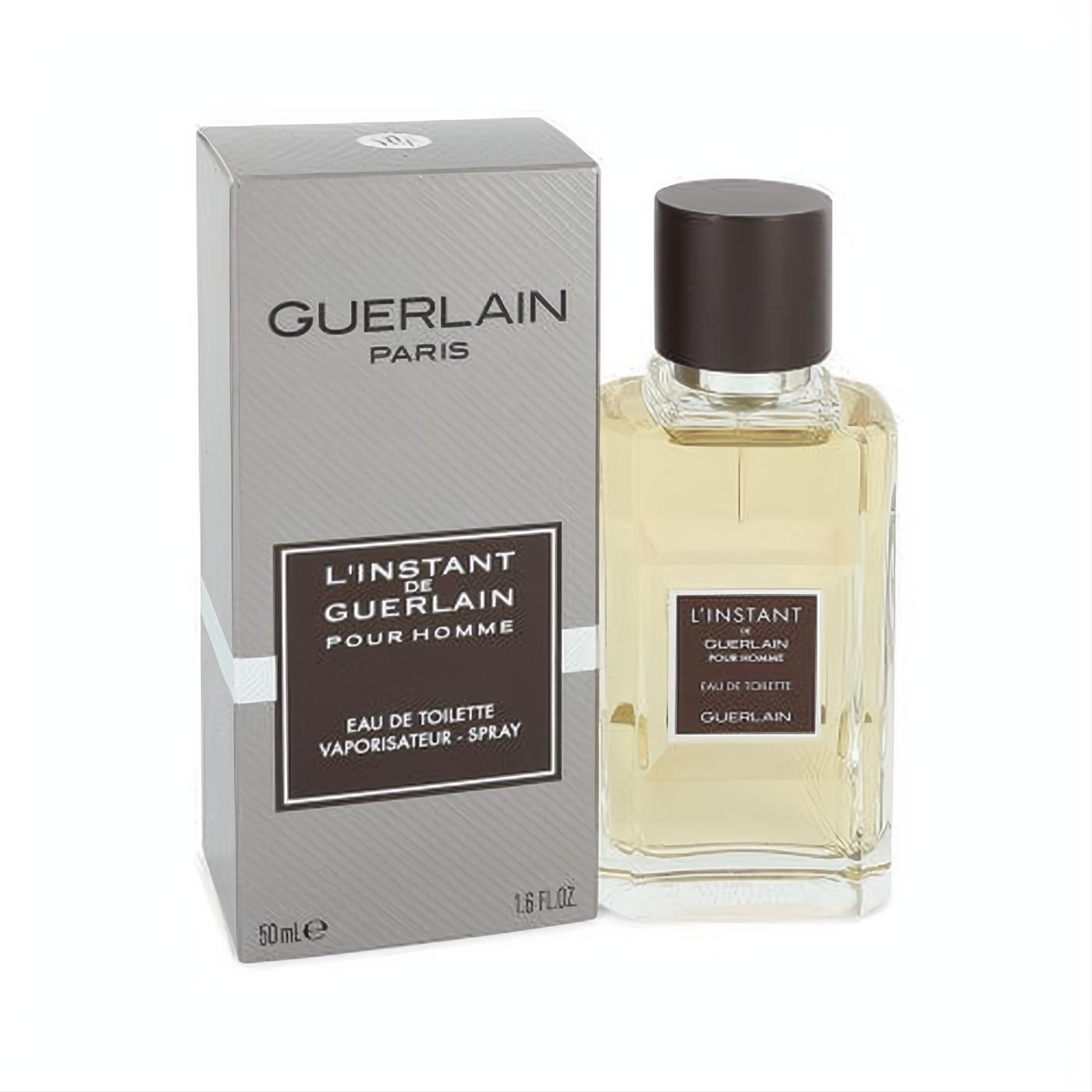 L'instant de Guerlain Pour Homme 1.6 oz EDT. Sophisticated clear glass bottle with amber fragrance and dark cap, alongside its sleek silver box.