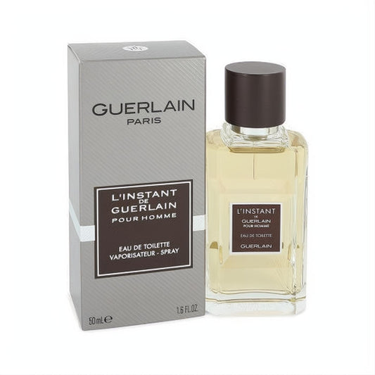 L'instant de Guerlain Pour Homme 1.6 oz EDT. Sophisticated clear glass bottle with amber fragrance and dark cap, alongside its sleek silver box.