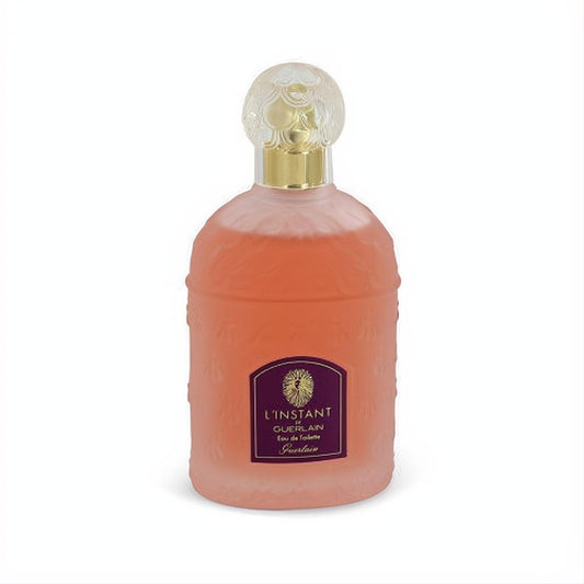 Sophisticated L'instant de Guerlain 3.3 oz EDT. Frosted pink bottle, embossed floral design, gold collar, and sculpted clear cap.