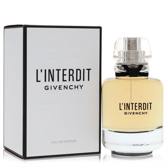 L'Interdit Givenchy Eau De Parfum: elegant bottle with light yellow liquid, clear faceted cap, black ribbon, and sleek white box.