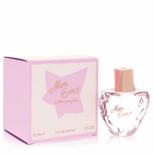 Captivating Lolita Lempicka Mon Eau 1 oz EDP. Clear heart-shaped bottle with faceted glass, rose gold cap, and pink box.