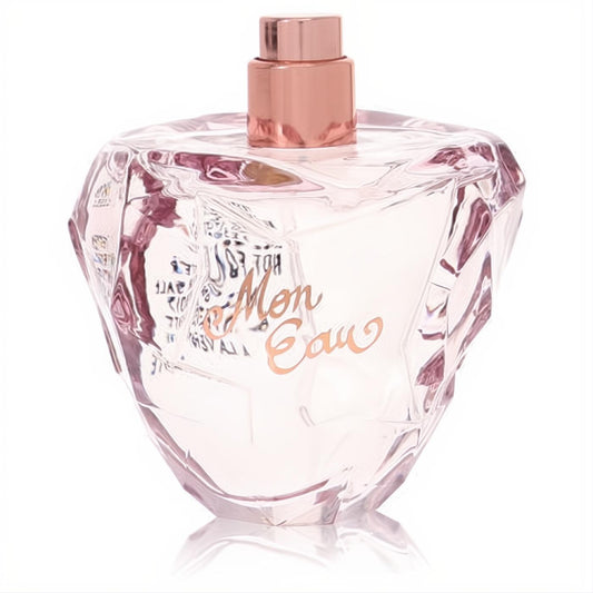 Lolita Lempicka Mon Eau women's perfume in a sparkling faceted pink glass bottle with a rose gold cap and elegant script.