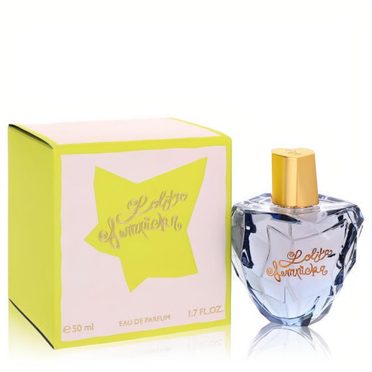 Lolita Lempicka 1.7 oz Eau De Parfum for women. Unique faceted light blue heart bottle with gold cap, next to its vibrant lime green box.