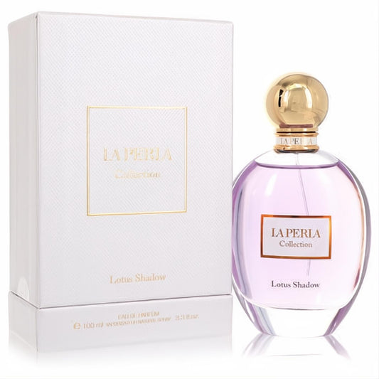 La Perla Lotus Shadow 3.3 oz EDP. Elegant lavender glass bottle with a gold cap and luxurious white textured box.
