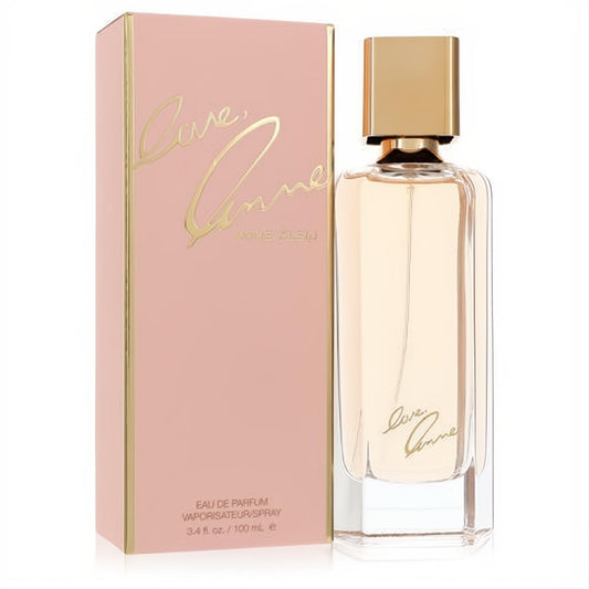 Love Anne by Anne Klein 3.4 oz EDP. Sophisticated clear glass bottle, light amber liquid, gold cap, and elegant rose gold box.