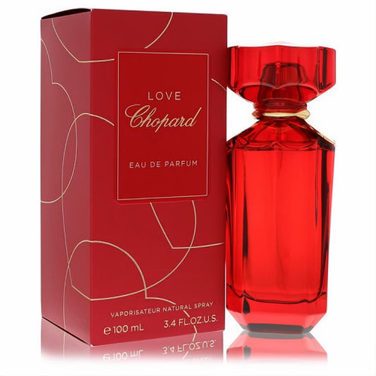 Captivating Love Chopard 3.4 oz Eau De Parfum in a vibrant red faceted glass bottle with gold accents and matching box.