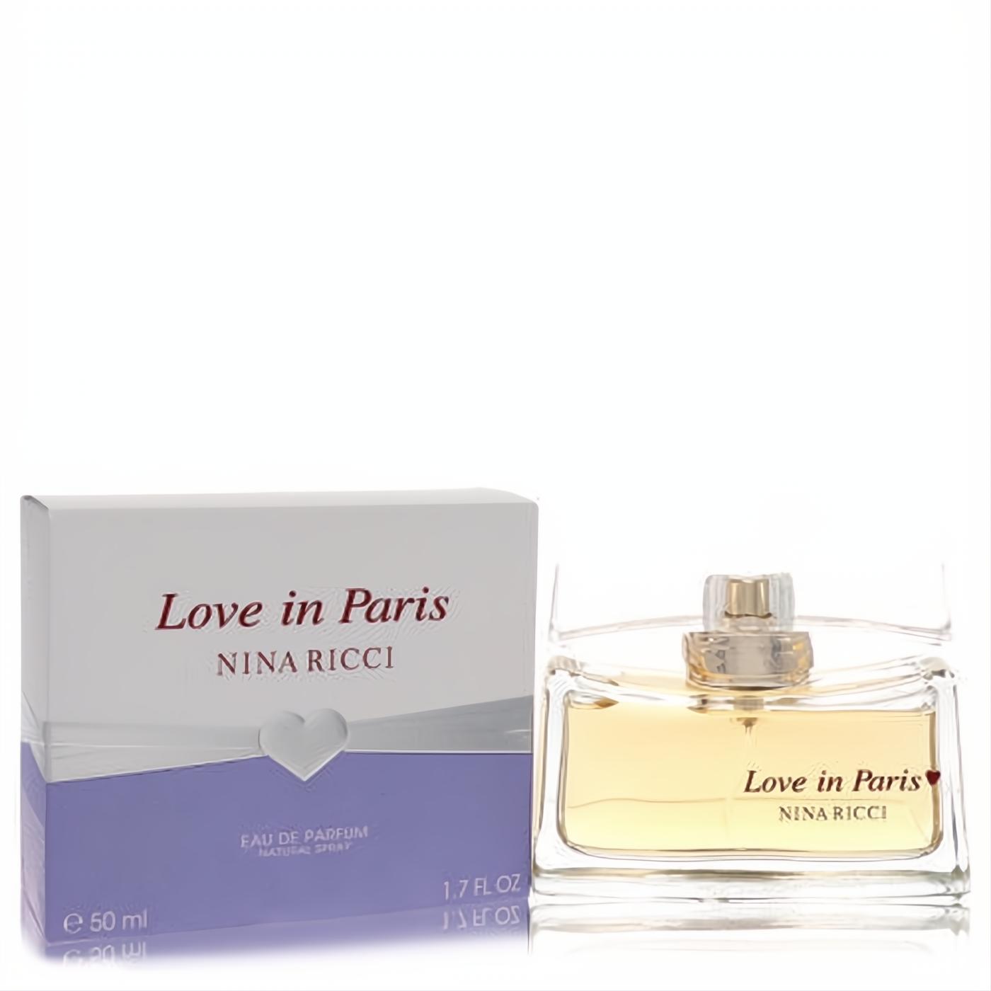 Experience Love In Paris Nina Ricci 1.7 oz EDP. Elegant clear glass bottle with golden liquid and chic white & lavender heart-design box.