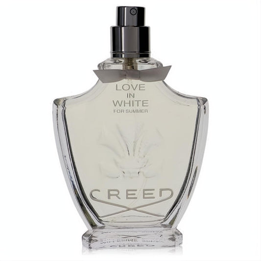 Exquisite Creed Love In White For Summer 2.5 oz women's perfume. Clear glass bottle, dark cap, elegant gray ribbon, and embossed floral design.