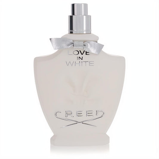 Elegant white Creed Love in White perfume bottle featuring a silver cap and delicate silver ribbon. Luxurious women's fragrance.
