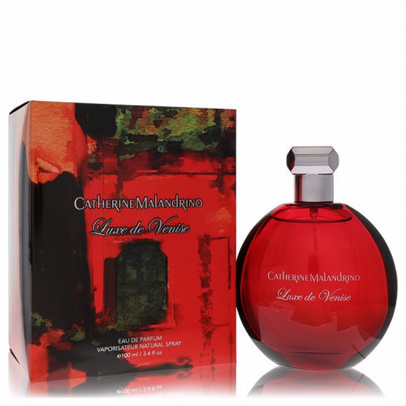 Discover Luxe De Venise 3.4 oz EDP: captivating deep red spherical bottle, sleek silver cap, and vibrant abstract art box.