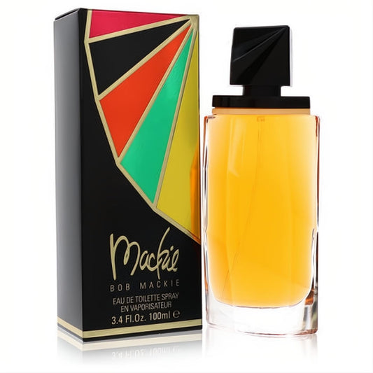 Captivating Mackie by Bob Mackie 3.4 oz EDT spray. Golden fragrance in a clear bottle with a sleek black cap, next to its vibrant geometric box.