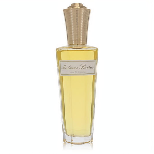 Elevate your scent with Madame Rochas 3.4 oz EDT spray. Clear glass bottle, golden liquid, and luxurious ribbed gold cap.