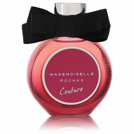 Mademoiselle Rochas Couture women's Eau de Parfum. Pink ribbed glass bottle with a magenta label, silver cap, and elegant black bow.