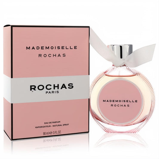 Discover Mademoiselle Rochas 3 oz Eau De Parfum. Chic pink ribbed glass bottle with white ribbon and elegant pink box.