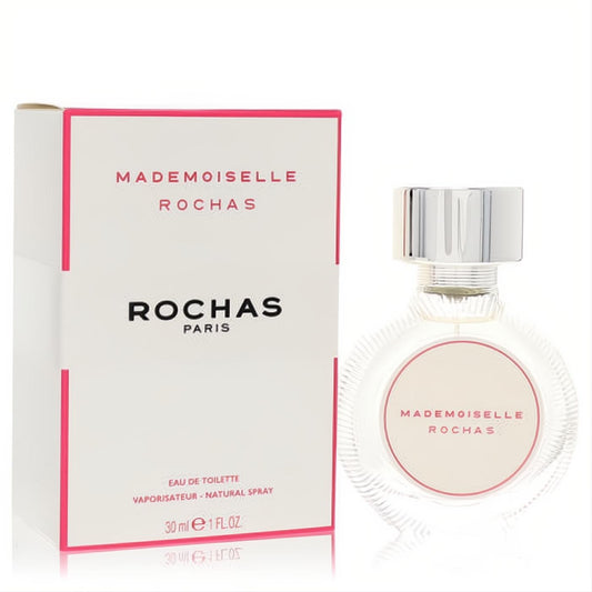 Mademoiselle Rochas 1 oz EDT spray: elegant ribbed glass bottle with silver cap & delicate pink label, next to its chic white & pink box.