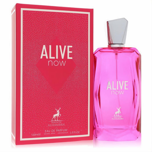 Stunning Maison Alhambra Alive Now 3.4 oz EDP in a vibrant pink geometric glass bottle with a faceted silver cap, beside its matching box.