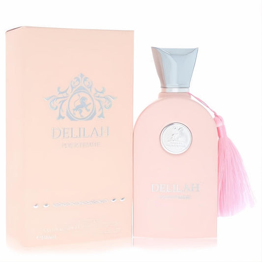 Maison Alhambra Delilah 3.4 oz women's EDP. Elegant light pink bottle with silver cap, ornate medallion, and pink tassel.