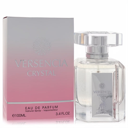 Luxurious Versencia Crystal 3.4 oz Eau De Parfum. Elegant clear faceted glass bottle, silver accents, and a chic pink-white gradient box.