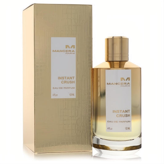 Stunning Mancera Instant Crush 4 oz unisex Eau De Parfum. Gold-capped clear glass bottle with amber liquid, beside a matching gold box.