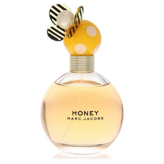 Marc Jacobs Honey Eau De Parfum: clear round bottle, amber liquid, unique yellow polka dot cap with playful bumblebee wings.