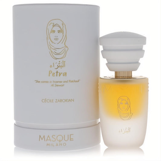 Elegant Masque Milano Petra EDP spray. Frosted bottle with gold accents, unique woman's silhouette, and white box with Arabic script.