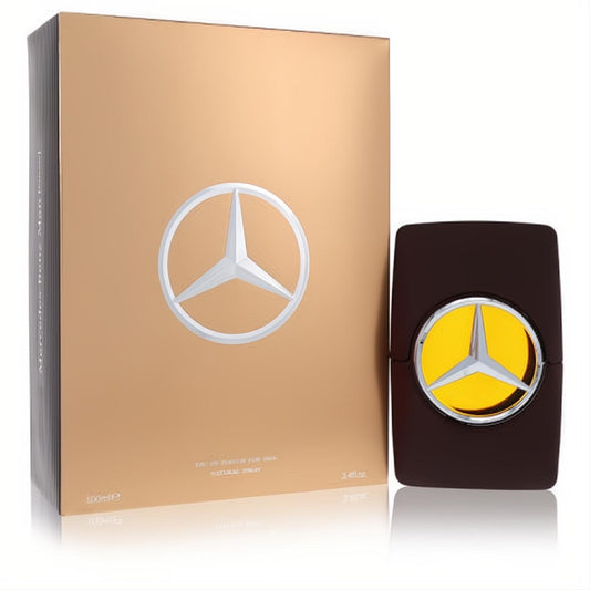 Elegant Mercedes Benz Private 3.4 oz Eau de Parfum. Dark brown bottle with silver logo reveals amber liquid, next to a luxurious golden box.