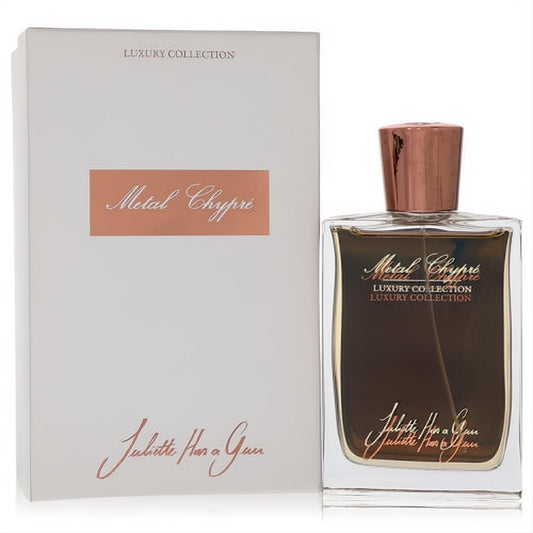 Juliette Has a Gun Metal Chypre 2.5 oz unisex Eau de Parfum. Luxurious clear bottle, dark liquid, rose gold cap, and elegant white box.
