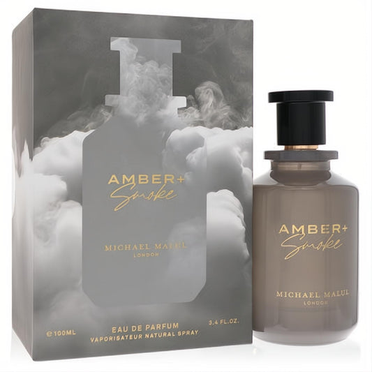 Michael Malul Amber + Smoke 3.4oz EDP. Sleek smoky gray bottle with gold text, paired with its elegant cloud-design box.
