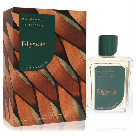 Elevate your scent with Michael Malul Edgewater 3.4oz EDP. Clear glass bottle, dark green cap, paired with a distinctive wood-patterned box.