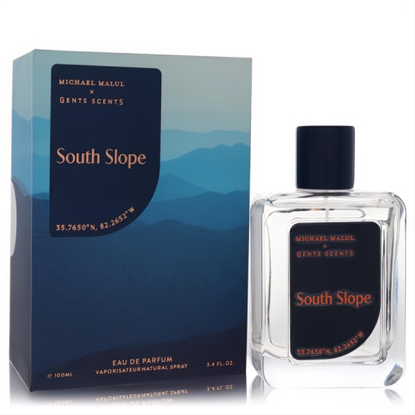 Michael Malul South Slope 3.4 oz Eau De Parfum. Clear glass bottle with dark label, alongside a striking blue mountain-themed box.