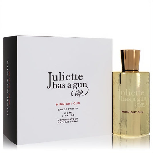 Elegant Juliette Has a Gun Midnight Oud 3.3 fl.oz gold Eau de Parfum spray bottle with sophisticated white and black packaging.