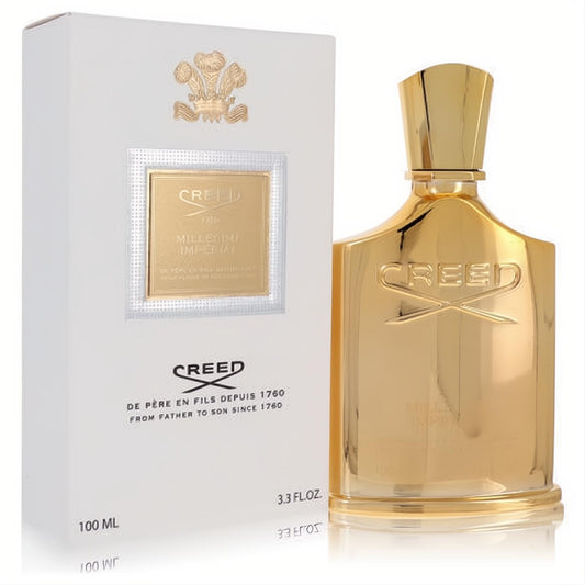 Regal Creed Millesime Imperial 3.3 oz EDP in a sleek metallic gold bottle, alongside its elegant white and gold crest box.
